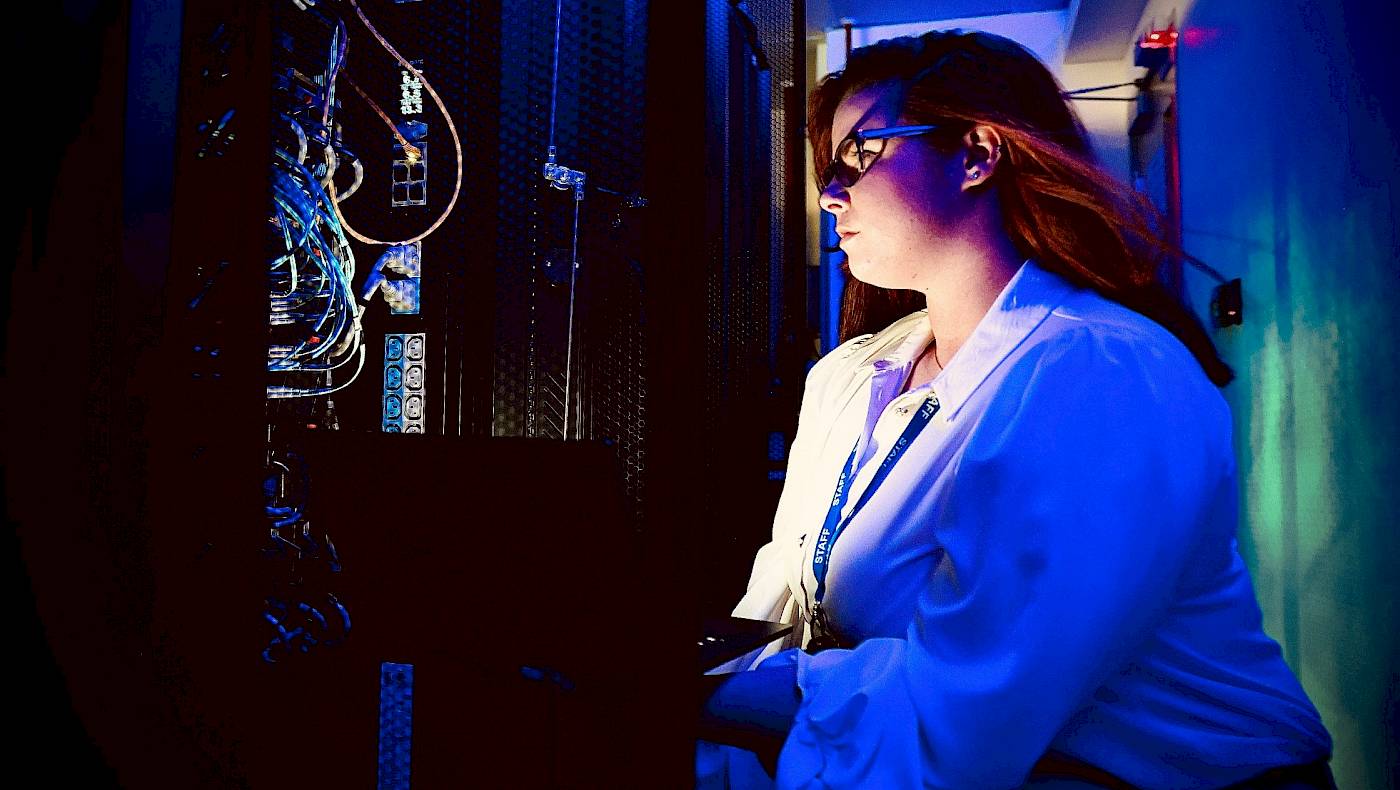 Female technician in server room