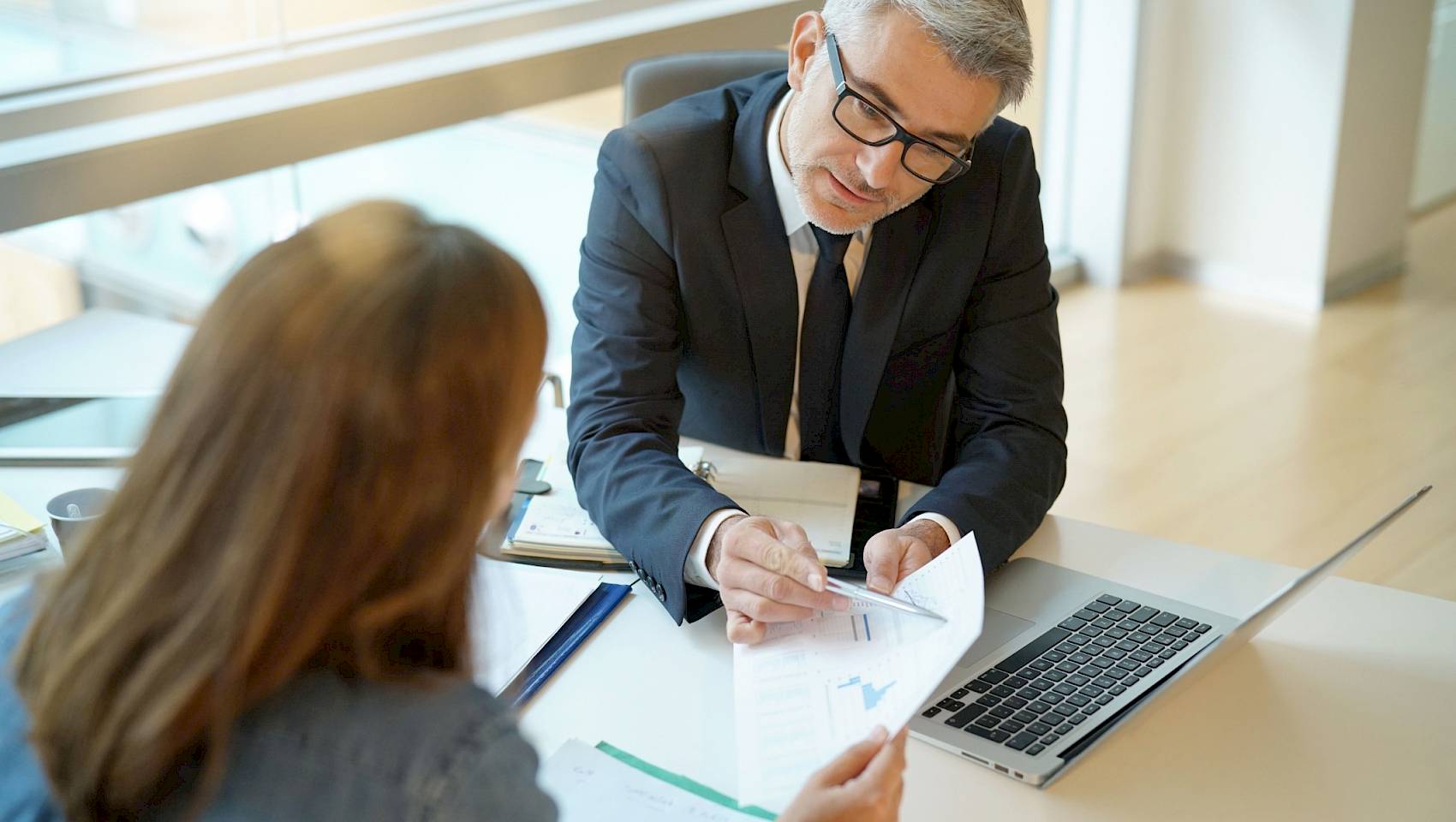 Professional male talking to colleague