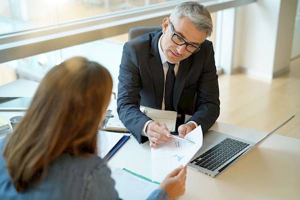 Professional male talking to colleague