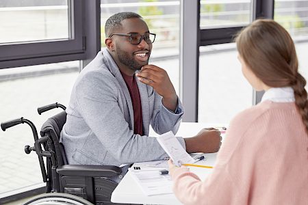 young male in wheelchair smiling