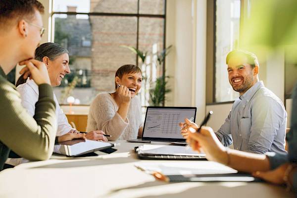 professional team around meeting table