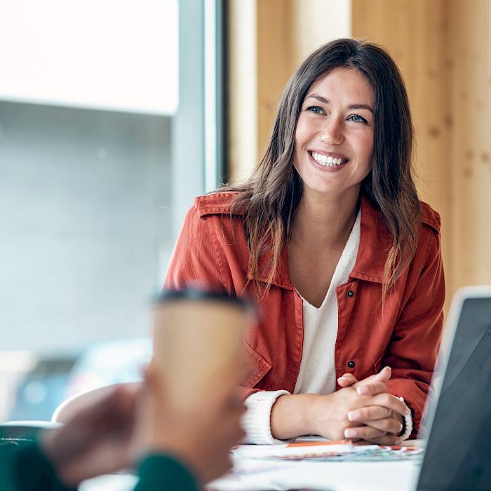 male and female colleagues smiling