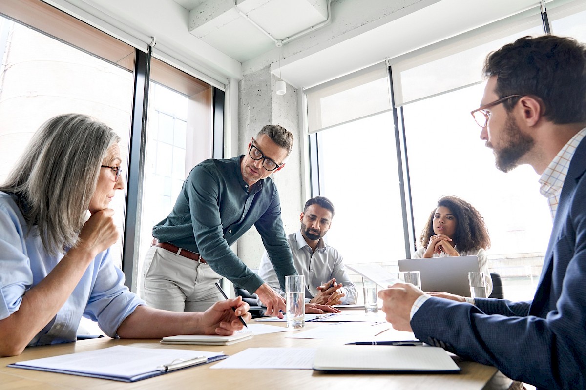 Colleagues having a meeting around a table