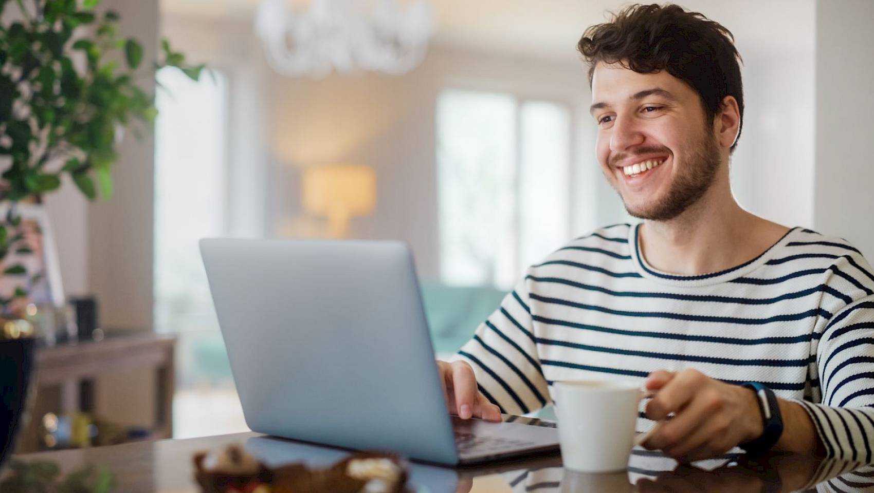 Lady using mobile tablet device smiling