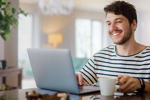 Lady using mobile tablet device smiling