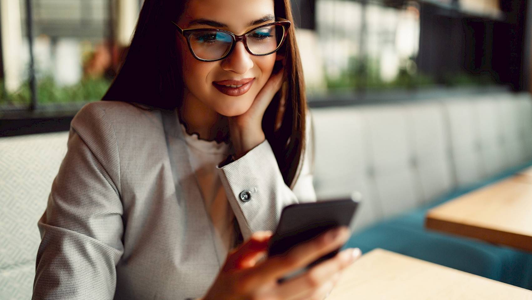 Female smiling and looking at her phone