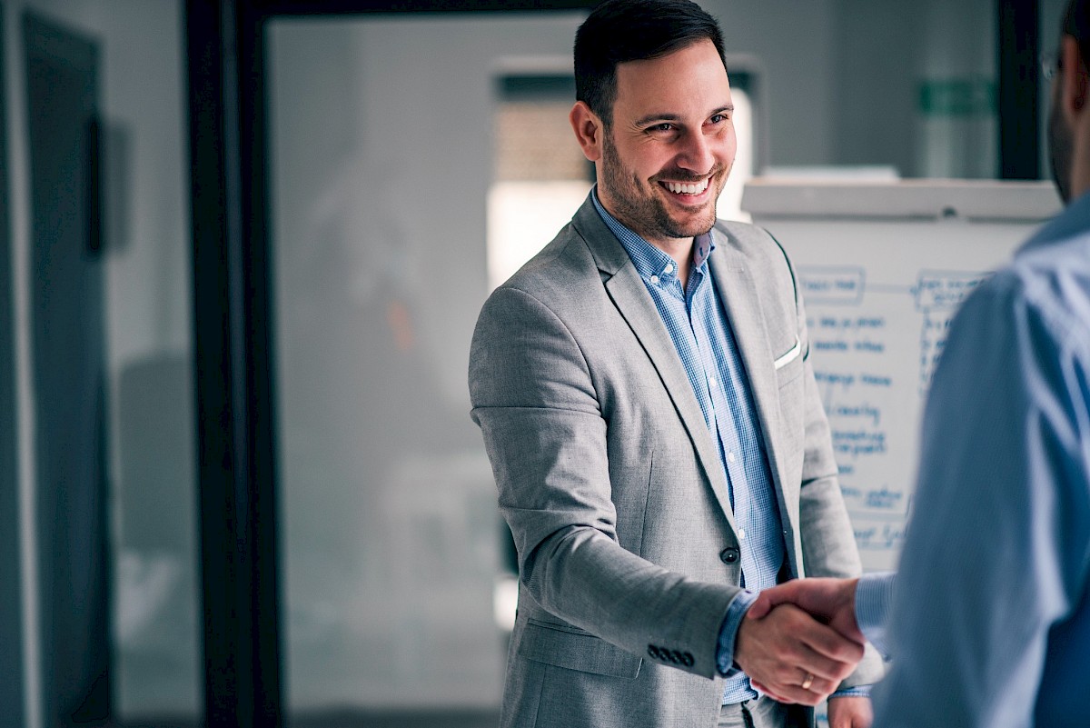 Man shaking hands with colleague