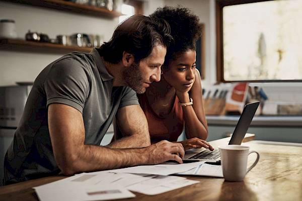 Couple looking at laptop