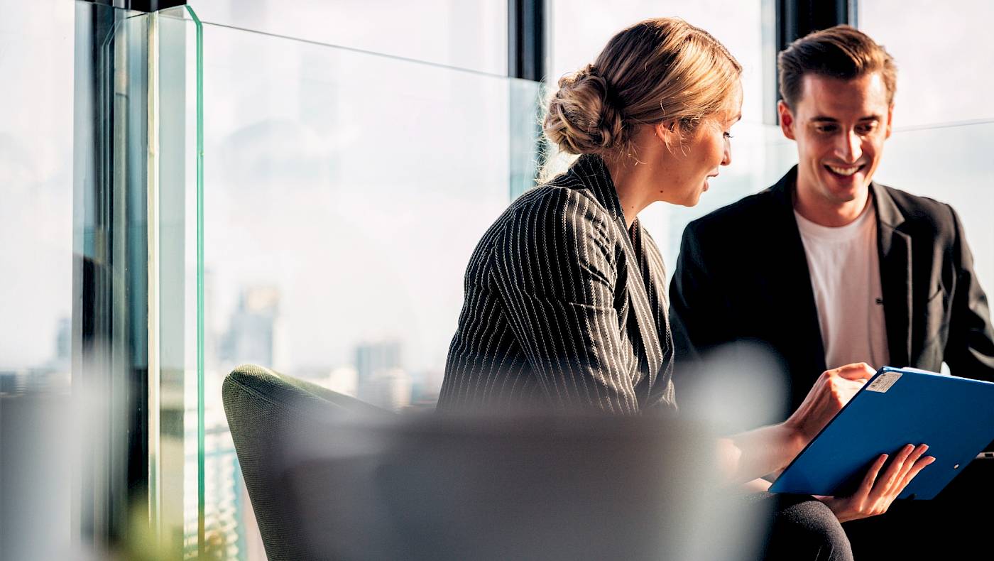 Confident woman leading a discussion with colleagues