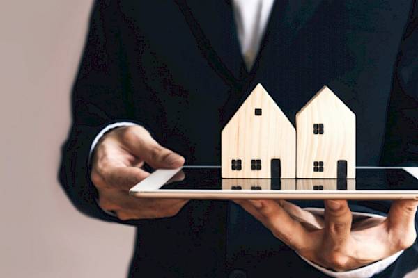 Image of a house with a sold sign on it