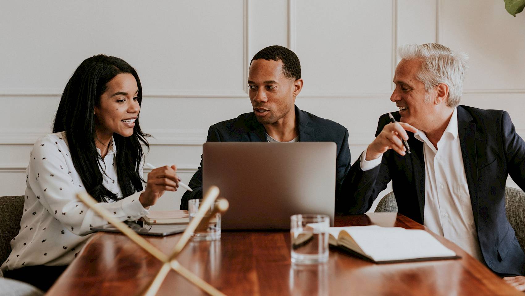 professional team looking at a laptop screen concentrating