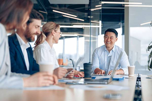 professional team in a meeting talking