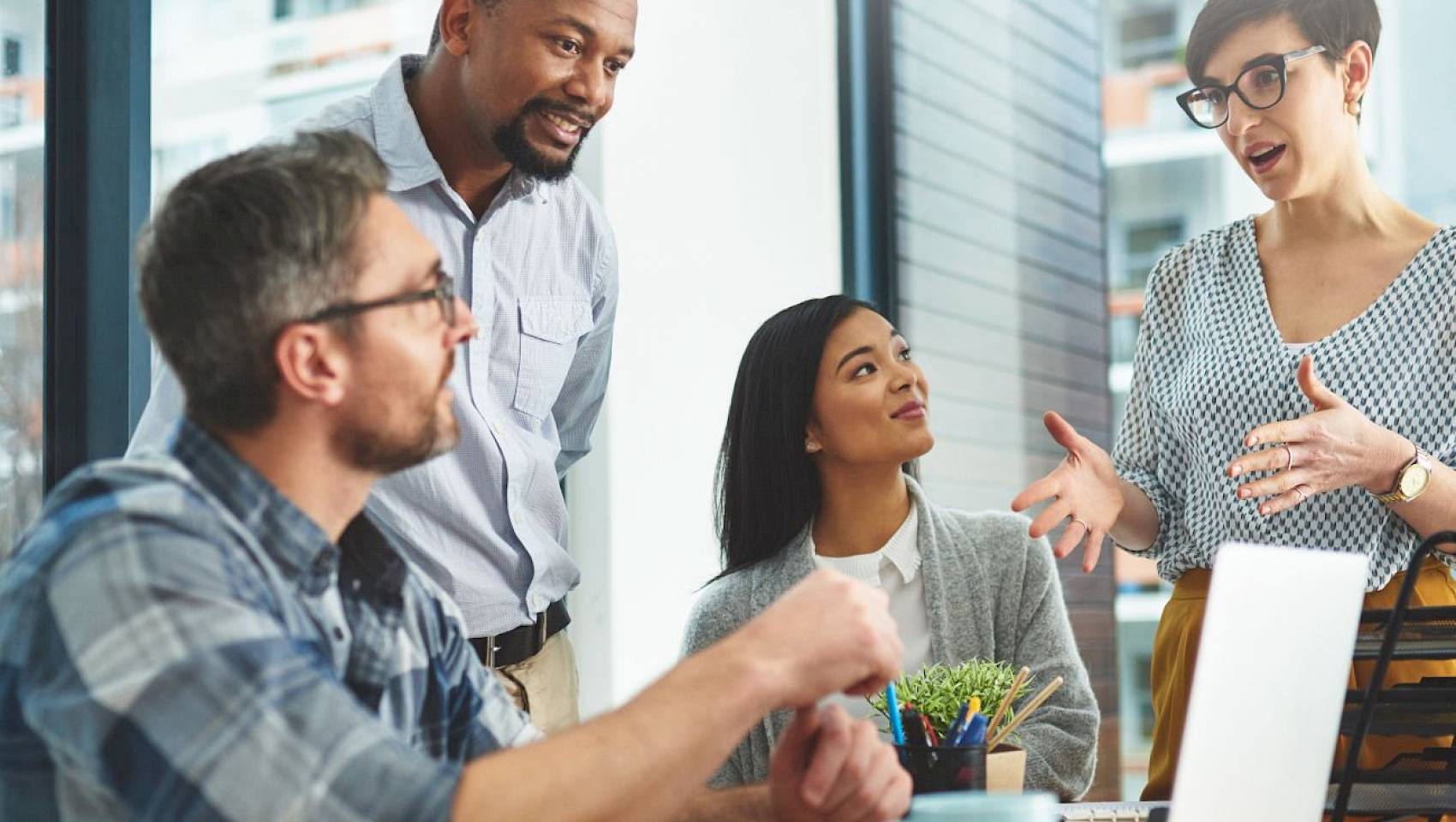 professional team in a meeting talking