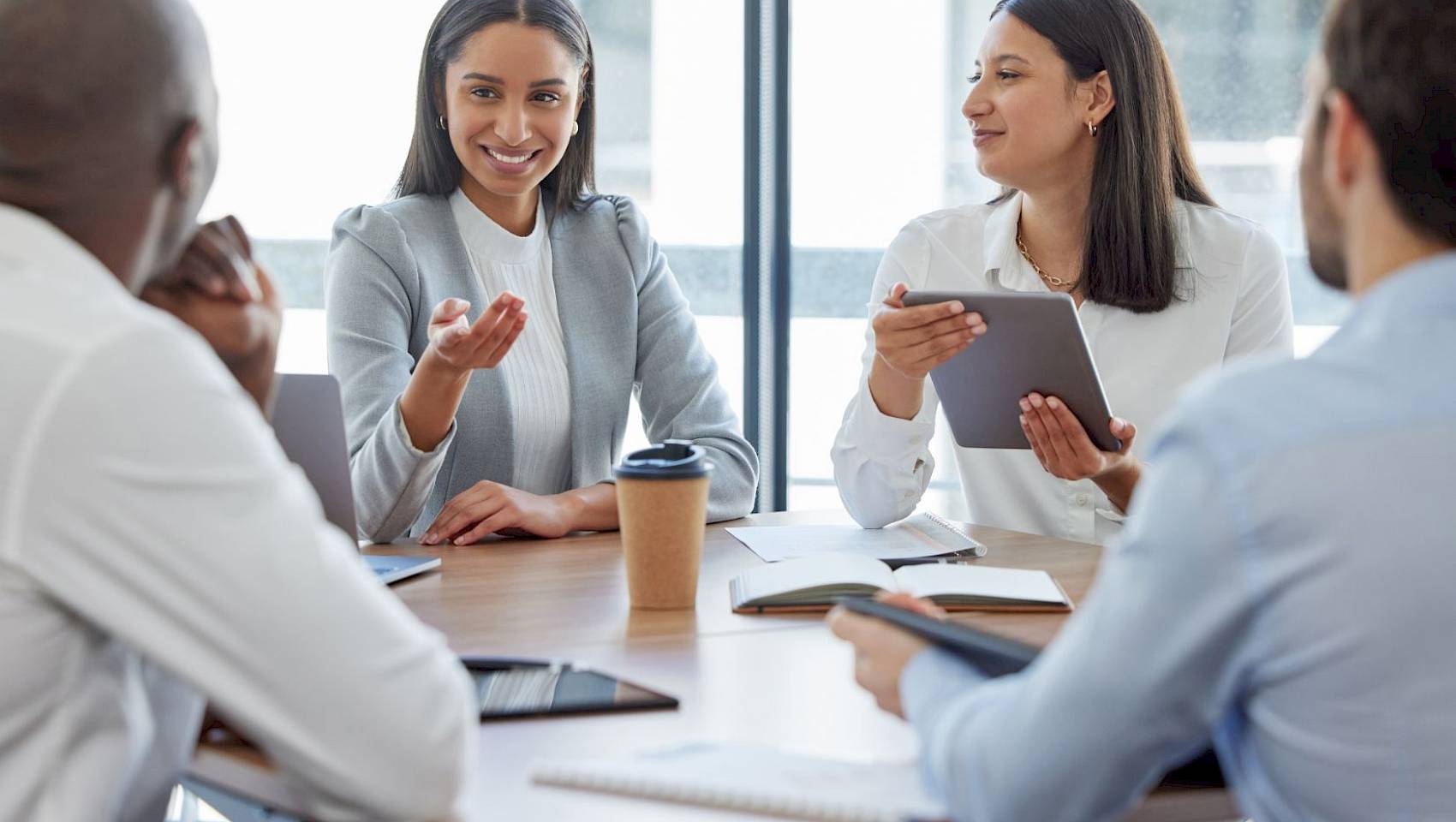 professional team in a meeting talking