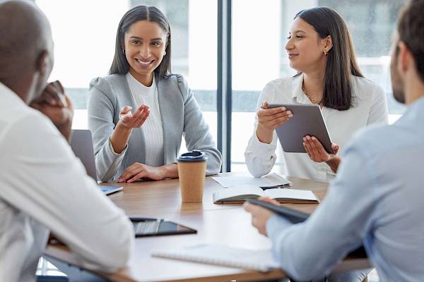 professional team in a meeting talking