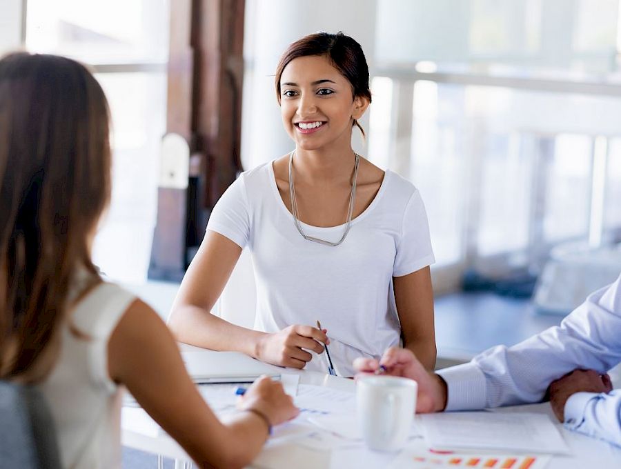 women in standing meeting